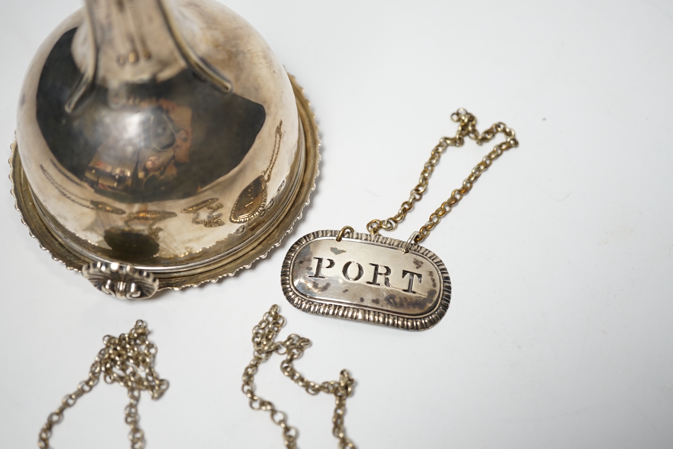 A George IV silver wine funnel, London, 1825, 12.9cm and four George III silver wine labels including pair by Phipps & Robinson, London, 1808/9.